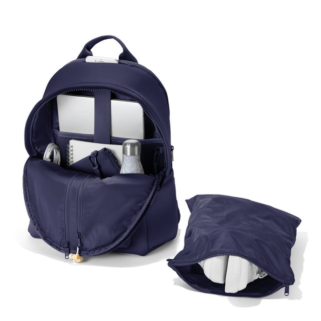 Dagne Dover large Dakota Neoprene Backpack in dark blue unzipped, showing the interior pockets and shoe bag.