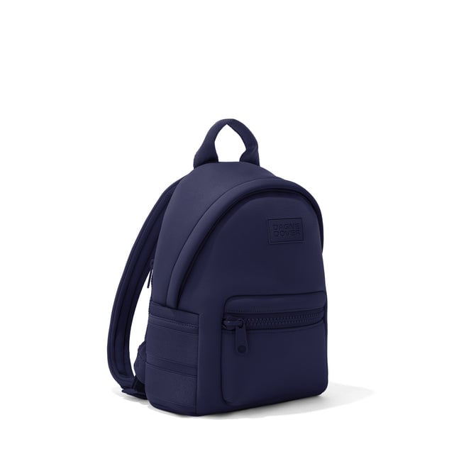 Dagne Dover small Dakota Neoprene Backpack in dark blue seen from an angle.