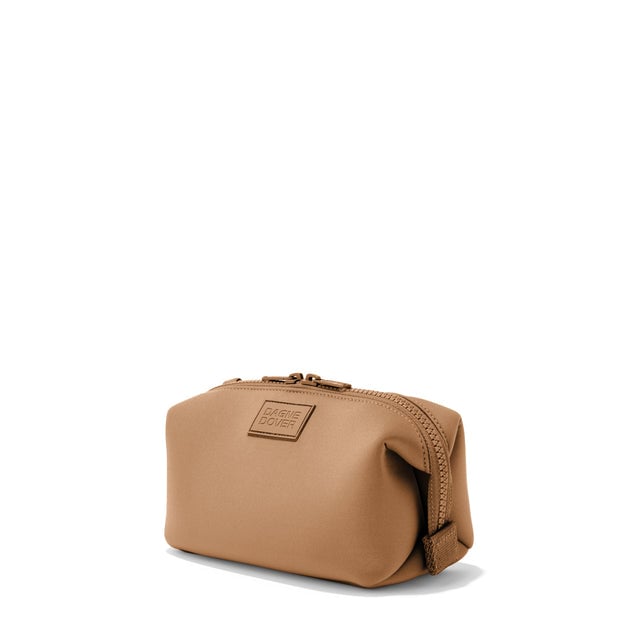 Dagne Dover Small Hunter Toiletry Bag in camel brown seen from an angle.