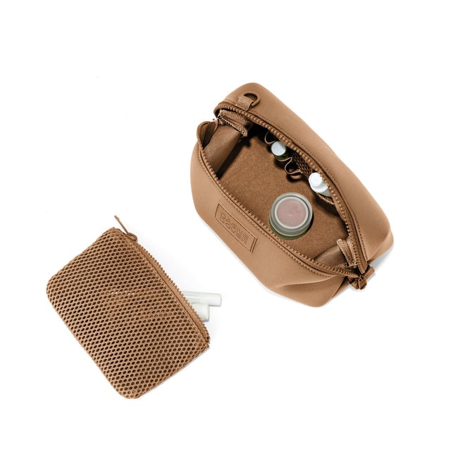 Dagne Dover Small Hunter Toiletry Bag in camel brown unzipped and seen from above with the removable air mesh pouch alongside it.
