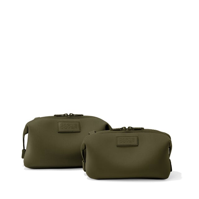 Dagne Dover Small and Large Hunter Toiletry Bags in dark green.