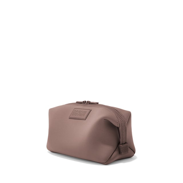 Dagne Dover Large Hunter Toiletry Bag in pink seen from an angle.