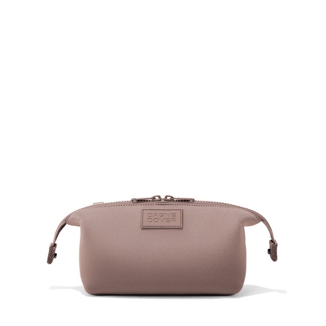 Dagne Dover Small Hunter Toiletry Bag in pink with sides unclipped.