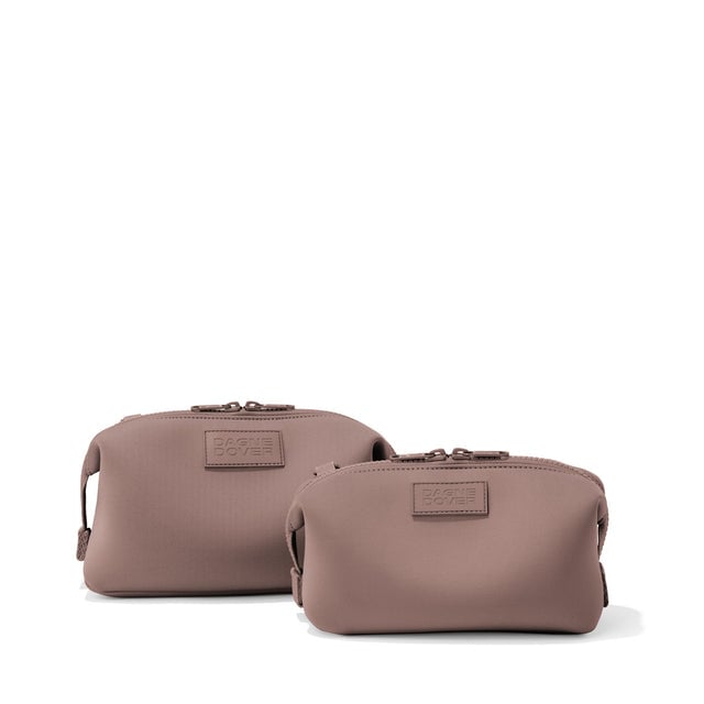 Dagne Dover Small and Large Hunter Toiletry Bags in pink.