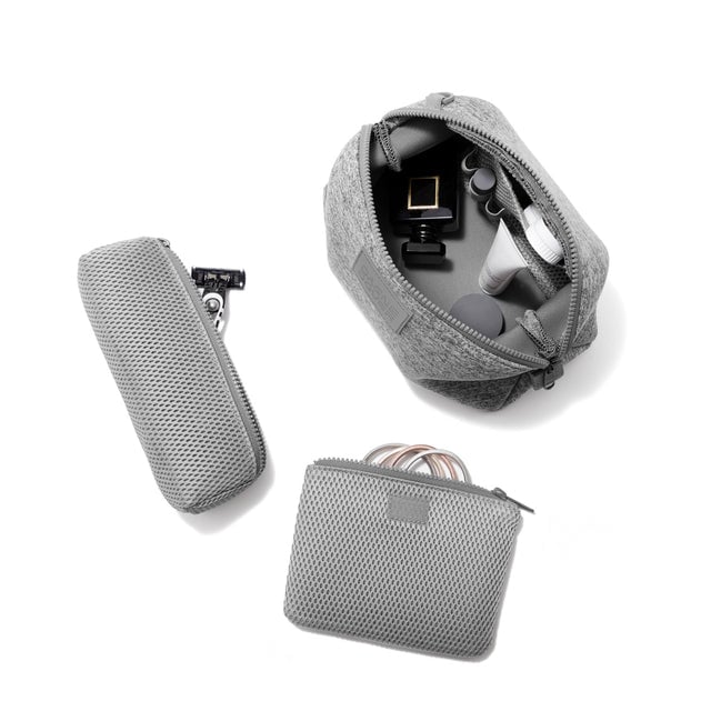 Dagne Dover Large Hunter Toiletry Bag in grey unzipped and seen from above with the removable air mesh pouch alongside it.