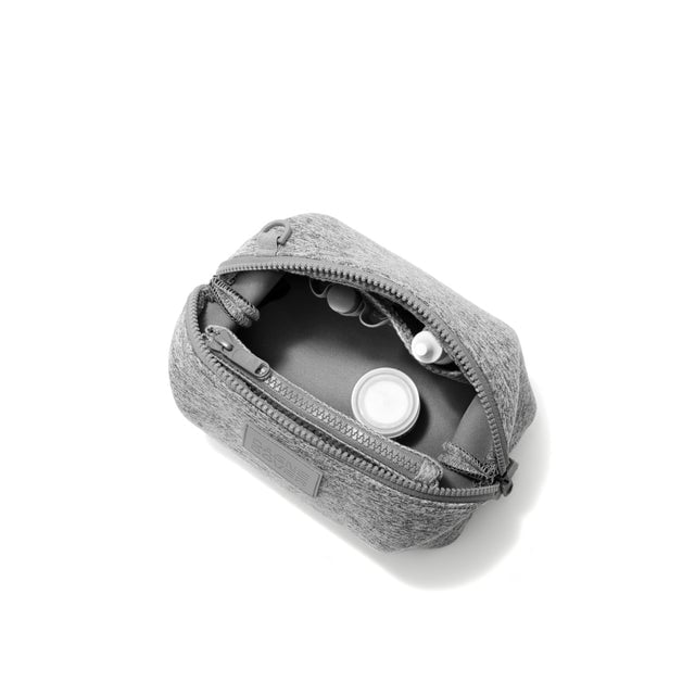 Dagne Dover Small Hunter Toiletry Bag in grey unzipped and seen from above.