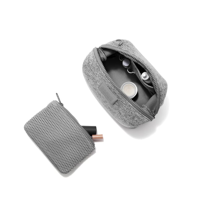 Dagne Dover Small Hunter Toiletry Bag in grey unzipped and seen from above with the removable air mesh pouch alongside it.