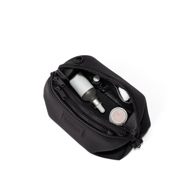 Dagne Dover Large Hunter Toiletry Bag in black unzipped and seen from above.