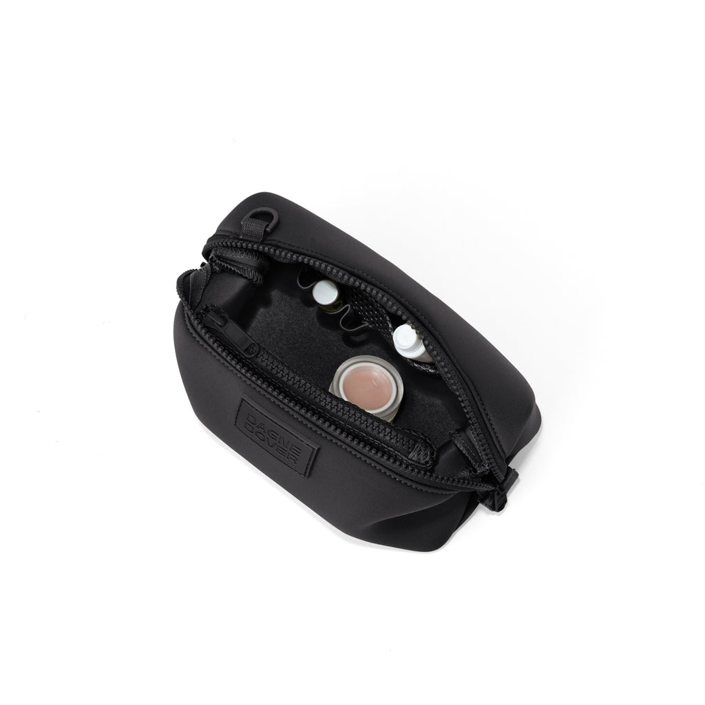 Dagne Dover Small Hunter Toiletry Bag in black unzipped and seen from above.