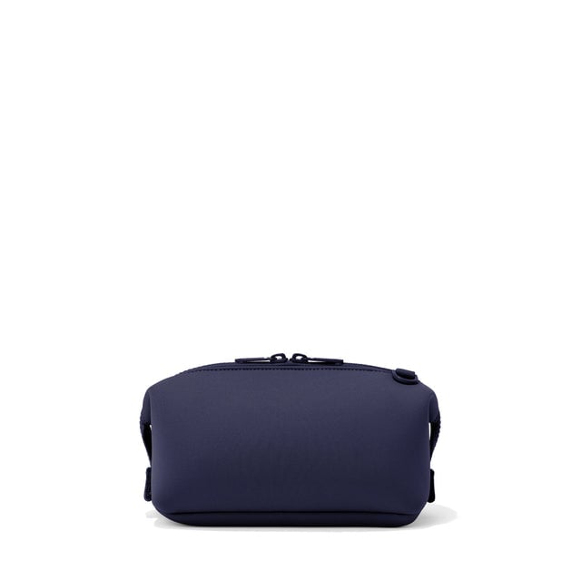 Dagne Dover Small Hunter Toiletry Bag in navy blue seen from the back.