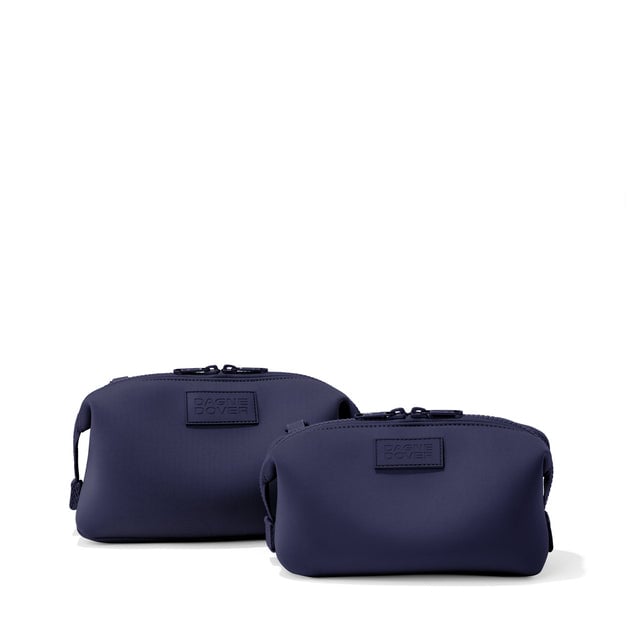 Dagne Dover Small and Large Hunter Toiletry Bags in navy blue.
