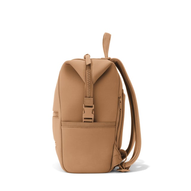 Dagne Dover Medium Indi Diaper Backpack in camel brown seen from the side.