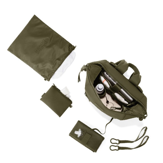 Dagne Dover Medium Indi Diaper Backpack in dark green showing it's water resistant bag, interior pockets, and changing mat.