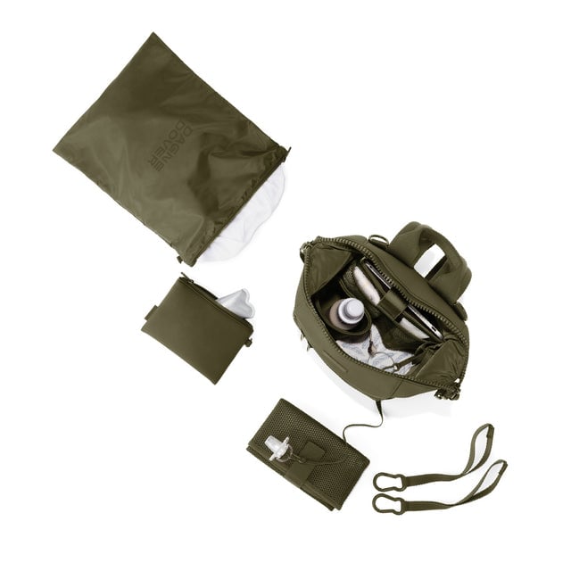 Dagne Dover Small Indi Diaper Backpack in dark green showing it's water resistant bag, interior pockets, and changing mat.