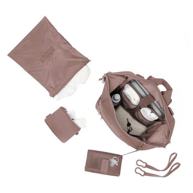 Dagne Dover Large Indi Diaper Backpack in dune pink showing it's water resistant bag, interior pockets, and changing mat.