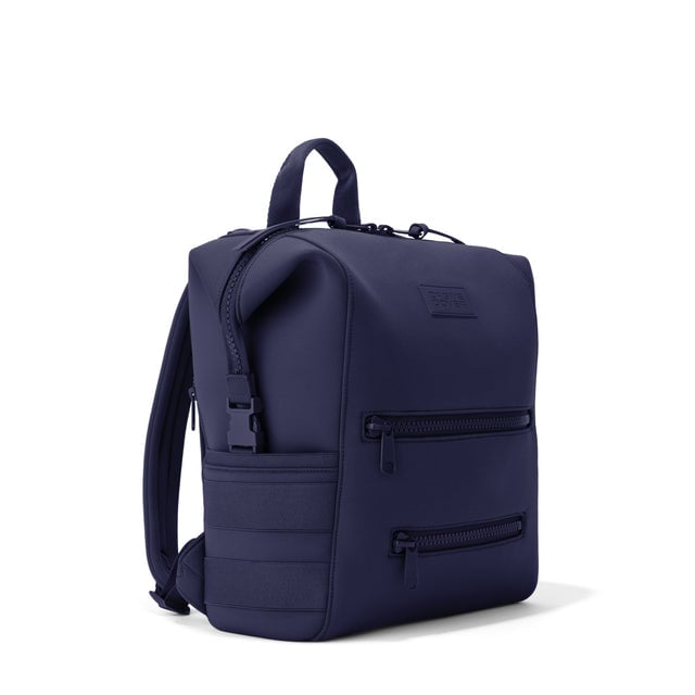 Dagne Dover Medium Indi Diaper Backpack in dark blue seen from an angle.