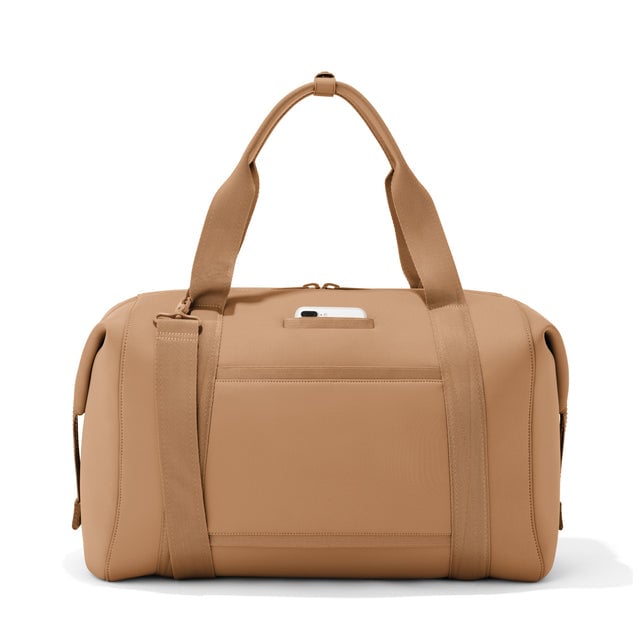 Extra large Landon Carryall in camel, displaying an exterior phone pocket