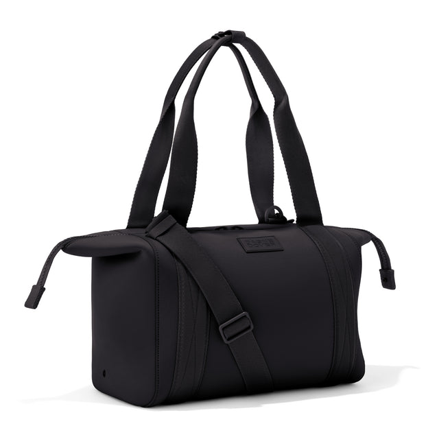 Medium Landon Carryall in black with zippers unbuckled