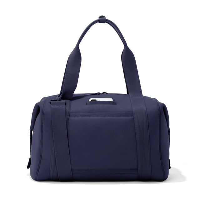 Large Landon Carryall in  navy blue, displaying an exterior phone pocket