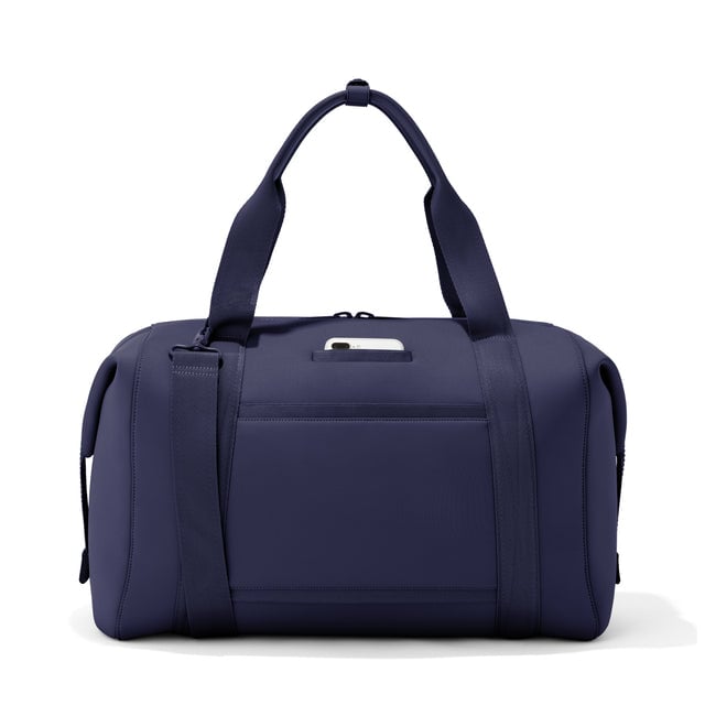 Extra Large Landon Carryall in  navy blue, displaying an exterior phone pocket