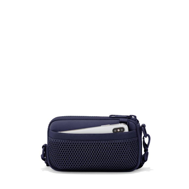 Dagne Dover Mara Phone Sling in navy blue showing the exterior air mesh slip.