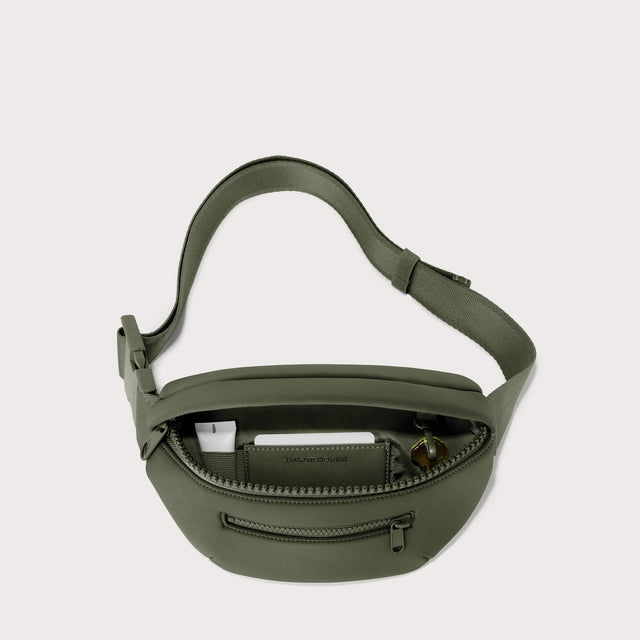 Dagne Dover Ace Fanny Pack in a cool green-grey unzipped, exposing the interior pockets. EDEAE8. 