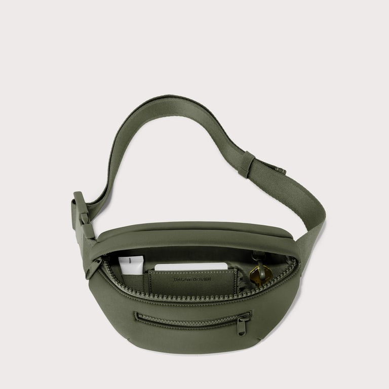 Dagne Dover Ace Fanny Pack in a cool green-grey unzipped, exposing the interior pockets. EDEAE8. 