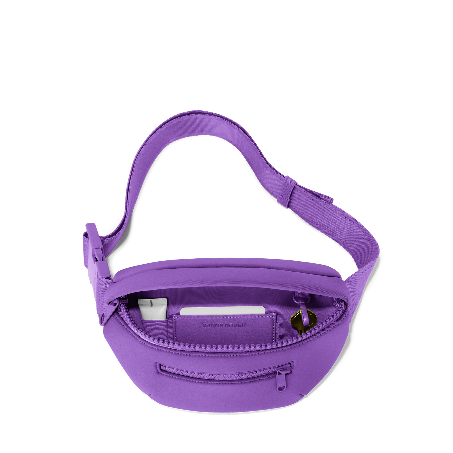 Dagne Dover Ace Fanny Pack in a bright saturated purple unzipped, exposing the interior pockets. hover