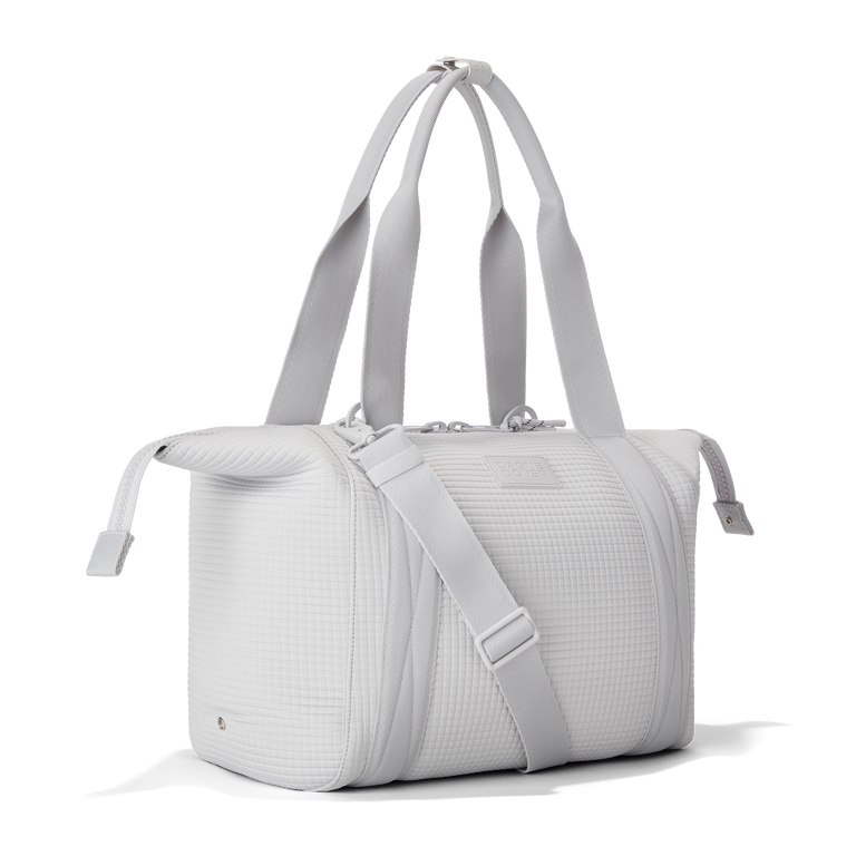Dagne Dover Medium Landon Carryall in a muted light grey with classic waffle texture with zippers unbuckled.