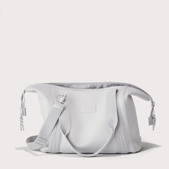 Dagne Dover Medium Landon Carryall in a muted light grey with classic waffle texture unzipped. EDEAE8 .