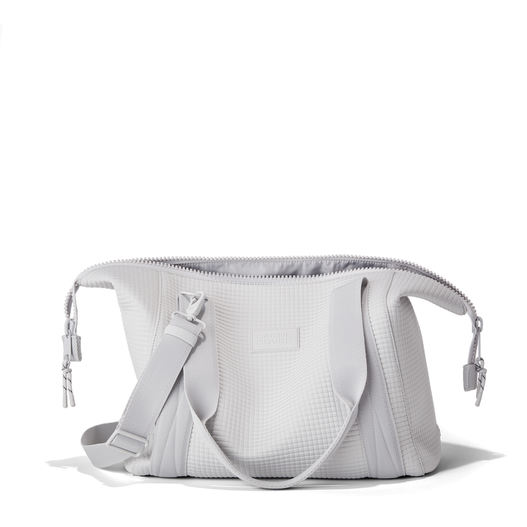 Dagne Dover Medium Landon Carryall in a muted light grey with classic waffle texture unzipped.