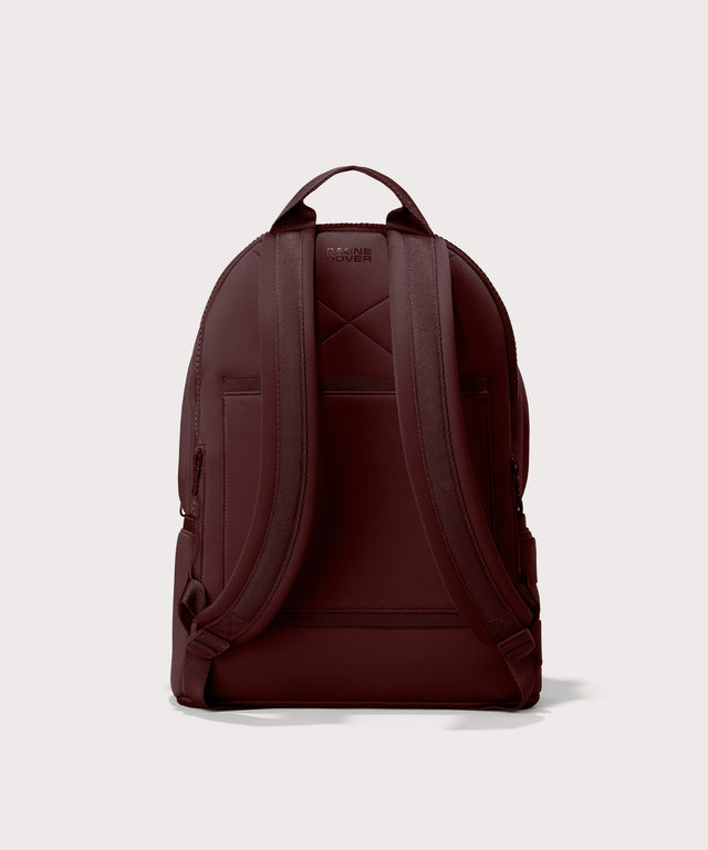 Dagne Dover Large Dakota Neoprene Backpack in a deep brown with purple undertones seen from the back.