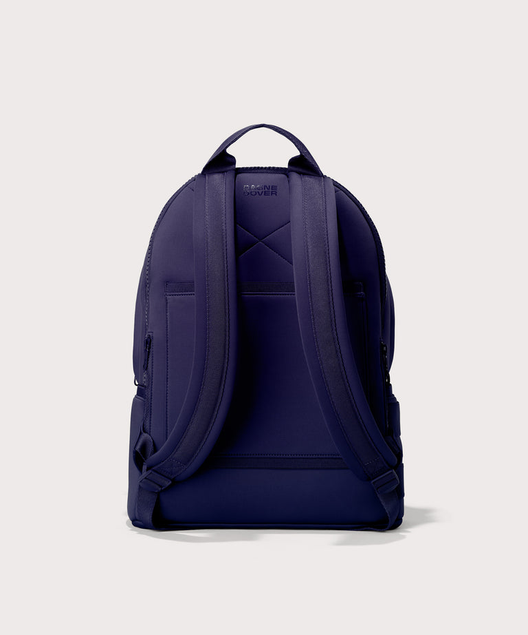 Large Dakota in a jewel-toned, deep blue with strong purple undertones., displaying an exterior phone pocket. Back view. 
