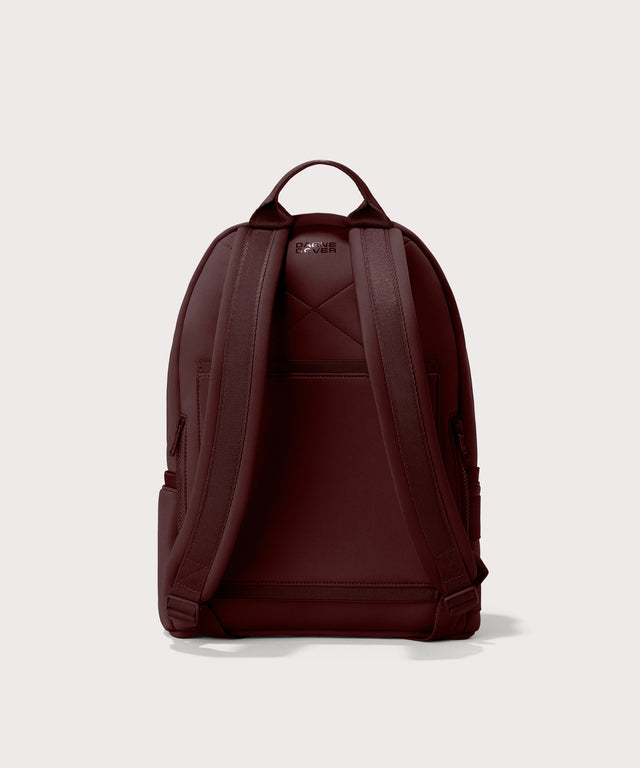 Dagne Dover Medium Dakota Neoprene Backpack in a deep brown with purple undertones seen from the back.