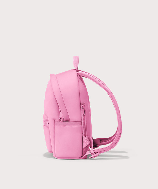 Dagne Dover Small Dakota Neoprene Backpack in a true bubble gum pink seen from the side.
