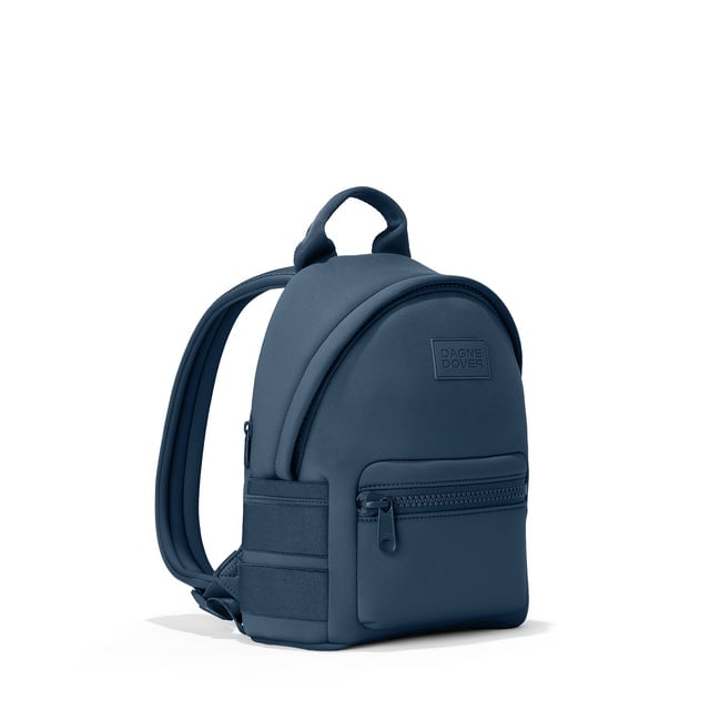 Dagne Dover small Dakota Neoprene Backpack in moonlight blue seen from an angle.