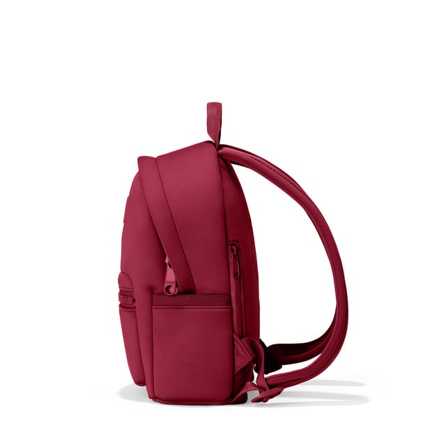 Dagne Dover small Dakota Neoprene Backpack in spice red seen from the side.