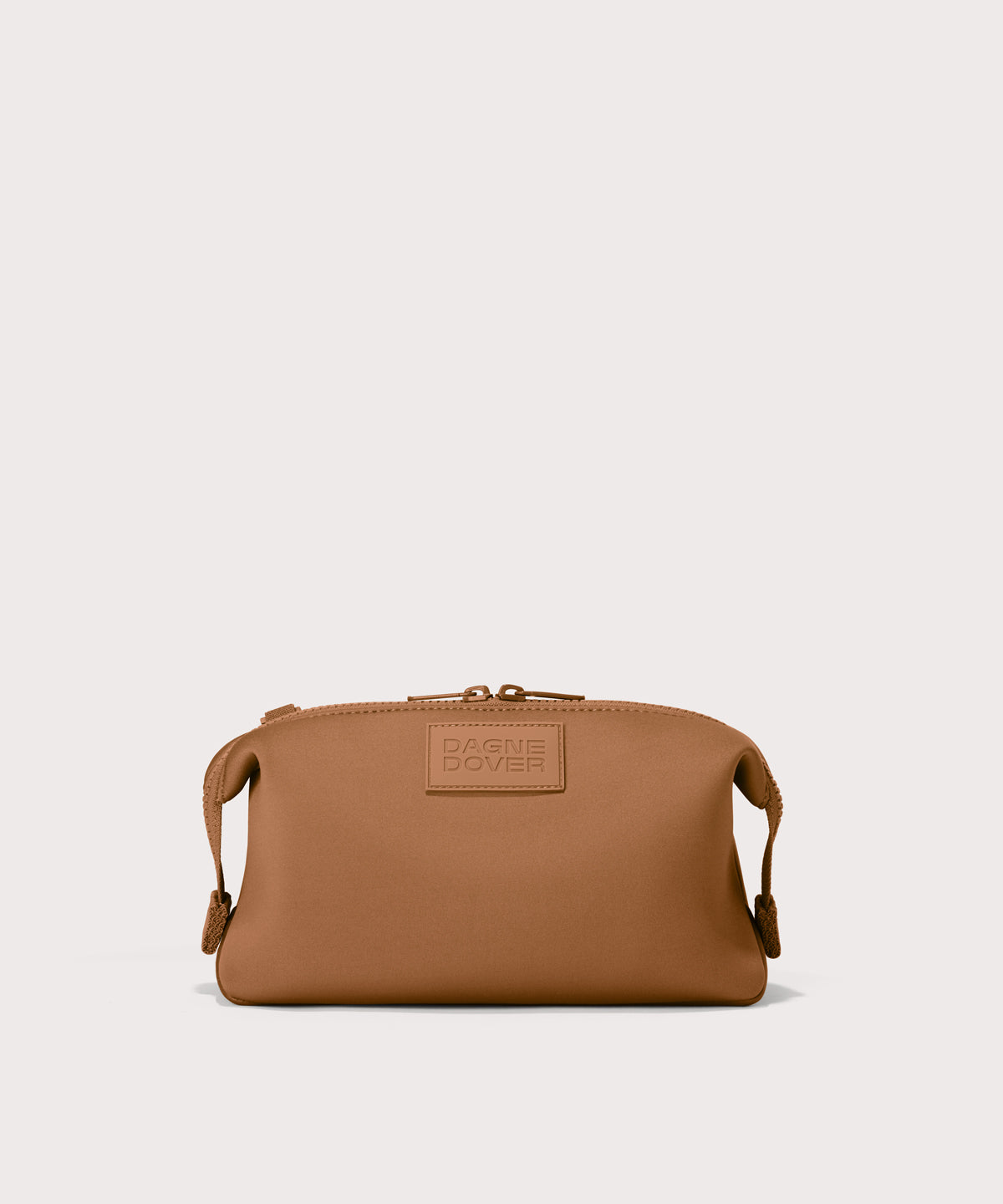 Hunter large toiletry bag in a saturated, warm medium-brown with burnt orange undertones
