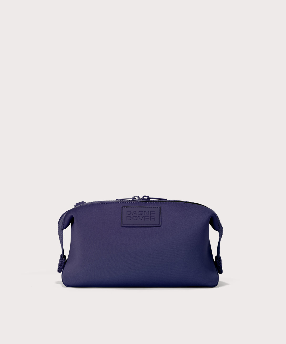 Hunter Large toiletry bag in  a jewel-toned, deep blue with strong purple undertones
