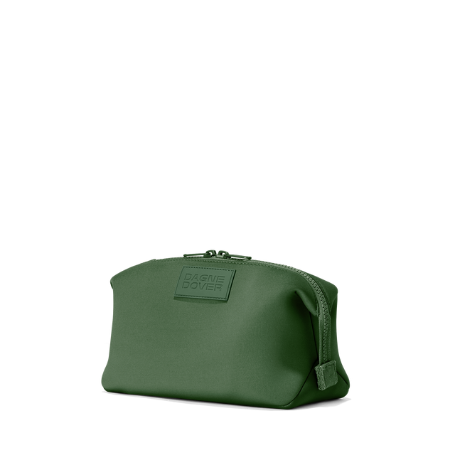 Dagne Dover Large Hunter Toiletry Bag in a rich, classic forest green seen from an angle.
