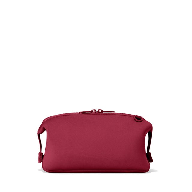 Dagne Dover Large Hunter Toiletry Bag in spice red seen from the back.