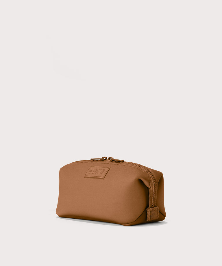 Hunter small toiletry bag in a saturated, warm medium-brown with burnt orange undertones. angle view. 
