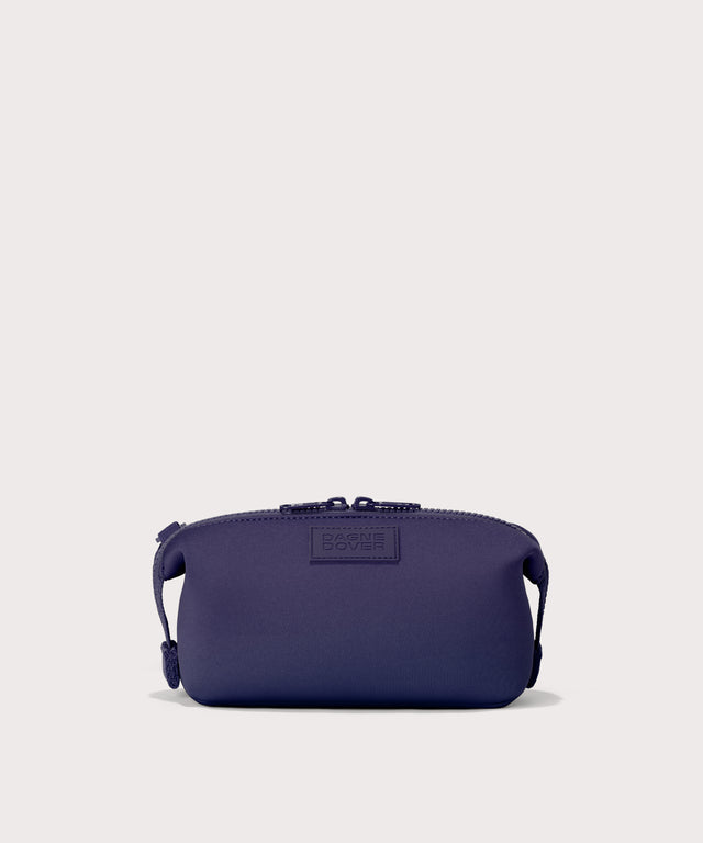Hunter small toiletry bag in a jewel-toned, deep blue with strong purple undertones.. Front view. 
