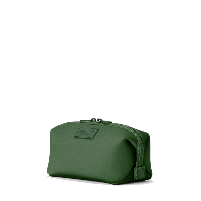 Dagne Dover small Hunter Toiletry Bag in a rich, classic forest green seen from an angle.
