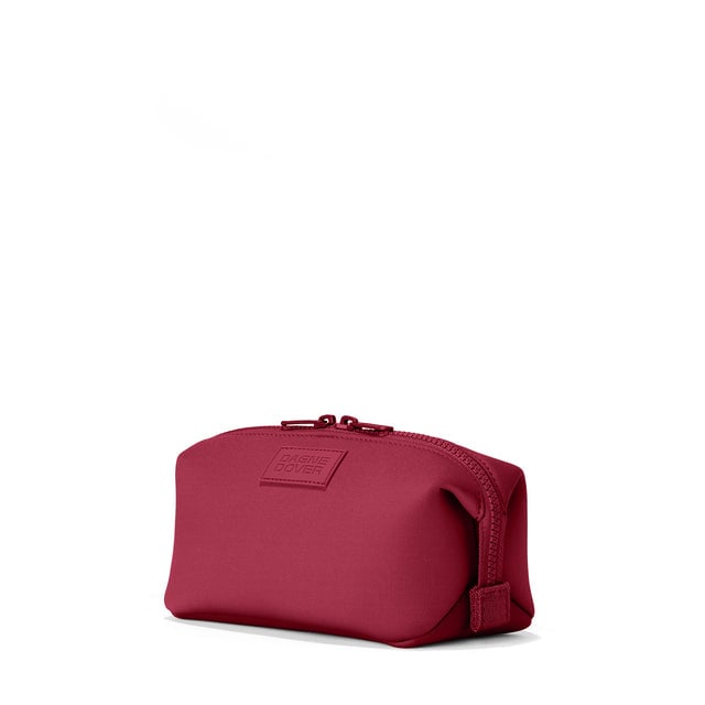 Dagne Dover Large Hunter Toiletry Bag in spice red seen from an angle.