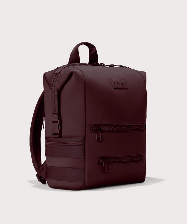 Dagne Dover Large Indi Diaper Backpack in a deep brown with purple undertones seen from an angle.