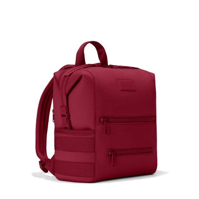 Dagne Dover Medium Indi Diaper Backpack in a punchy, saturated deep red seen from an angle.