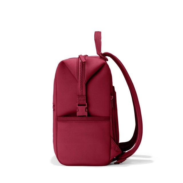 Dagne Dover Medium Indi Diaper Backpack in a punchy, saturated deep red seen from the side.