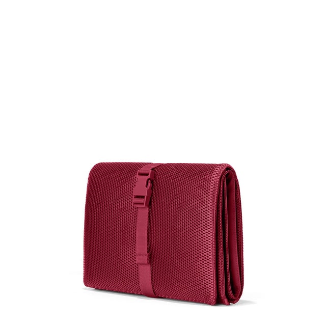 Dagne Dover Joey Changing Kit in spice red seen from an angle.