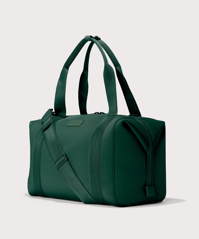 Large Landon Carryall in a saturated, jewel-toned deep green with bold blue undertones., side angle view
